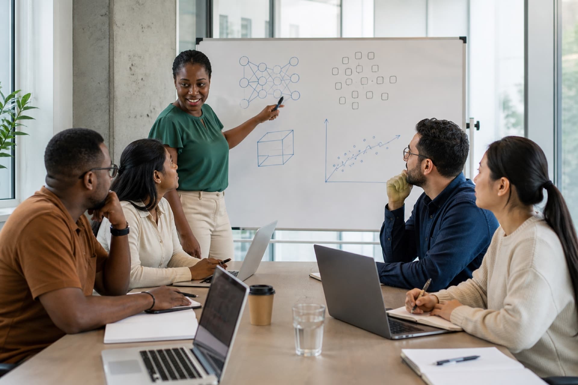 Diverse professionals in a Machine Learning and AI teaching workshop